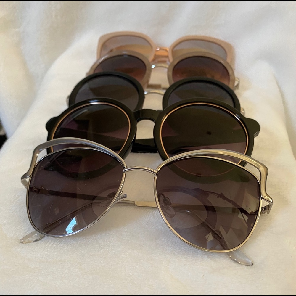 5 pairs of Fashion sun glasses. Lightly worn.